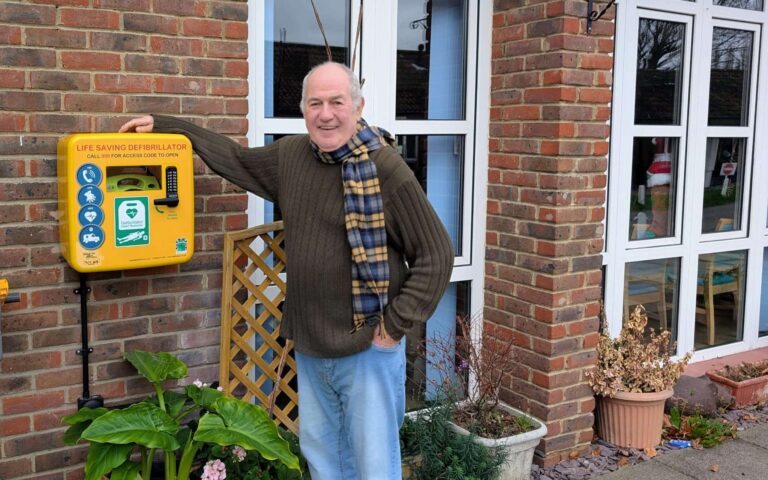 Community AED installed outside a residential home for public use during cardiac arrest emergencies