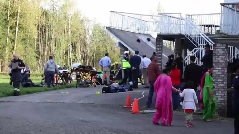 First responders providing first aid after a deck collapse during a crowded pre-wedding celebration in Langley, British Columbia