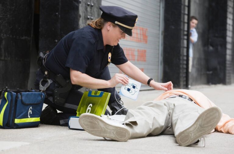 Police officer using AED to help save cardiac arrest victim in western Quebec