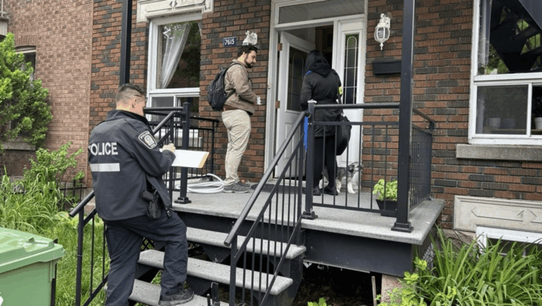 Police investigators speaking with parents outside a residential home in Lachine during a near-drowning investigation