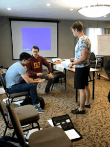 First aid training session demonstrating emergency response techniques during a CPR and safety awareness class