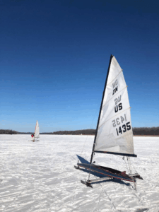 Iceboat sailing on frozen lake near Bay of Quinte during winter conditions